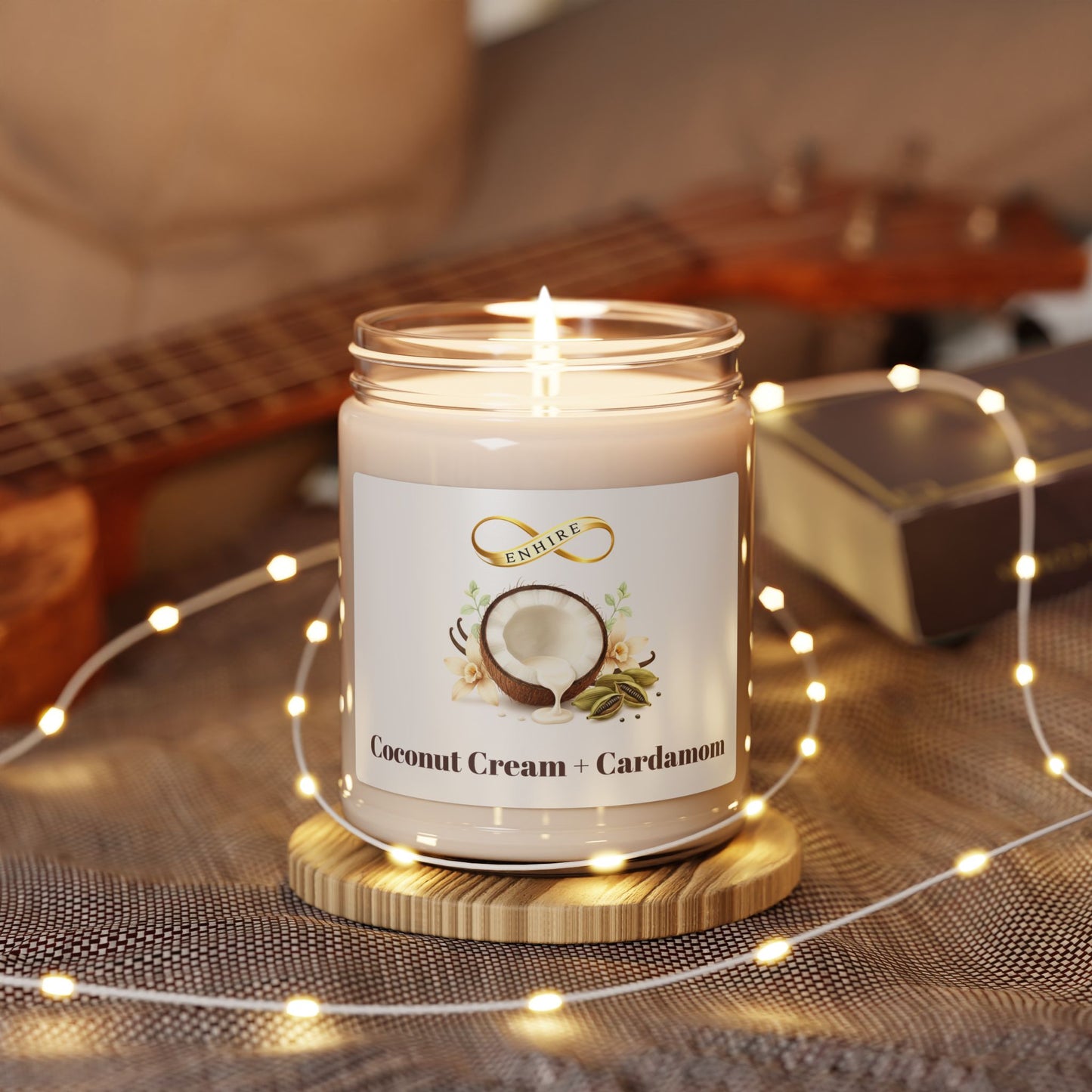 Coconut cream and cardamom scented soy candle in glass jar with warm cozy aroma